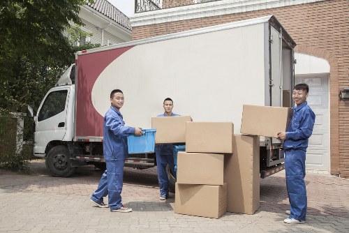 Removal vehicle loading furniture on a residential street in Palmers Green