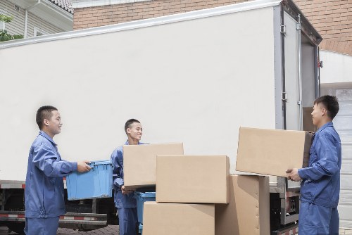 Moving boxes and furniture prepared for a local home move in Palmers Green