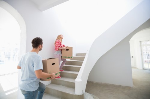 Mover wearing PPE and handling furniture with care